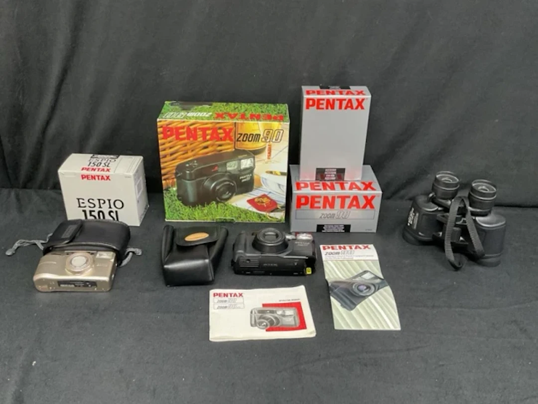 A boxed Pentax Espio 150SL 35mm compact zoom camera; a boxed Pentax
