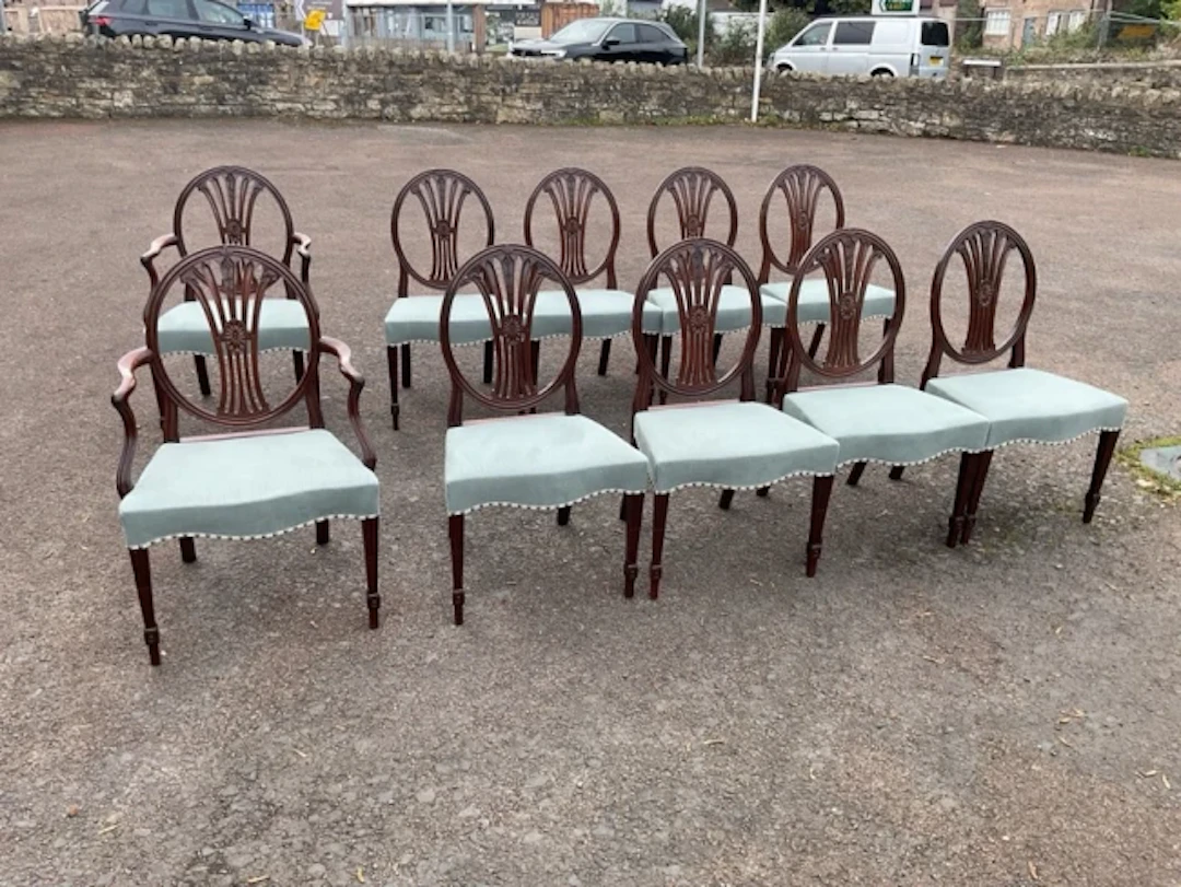 A set of ten Hepplewhite style period mahogany dining chairs, the