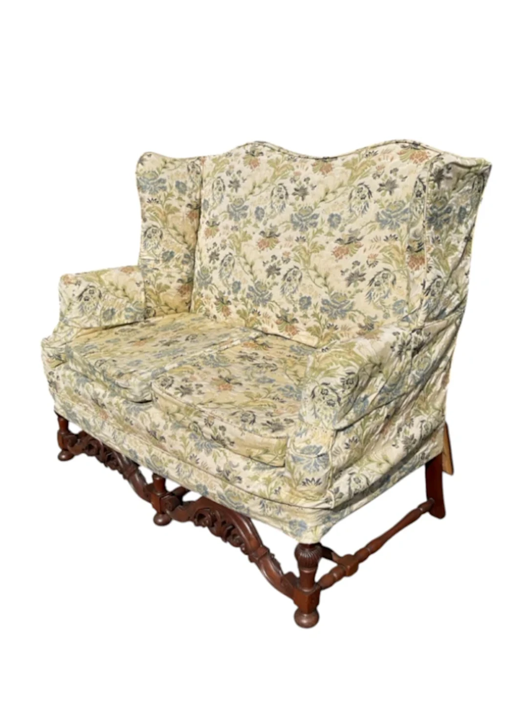 A Queen Anne style sofa with high camel back and shaped wings above