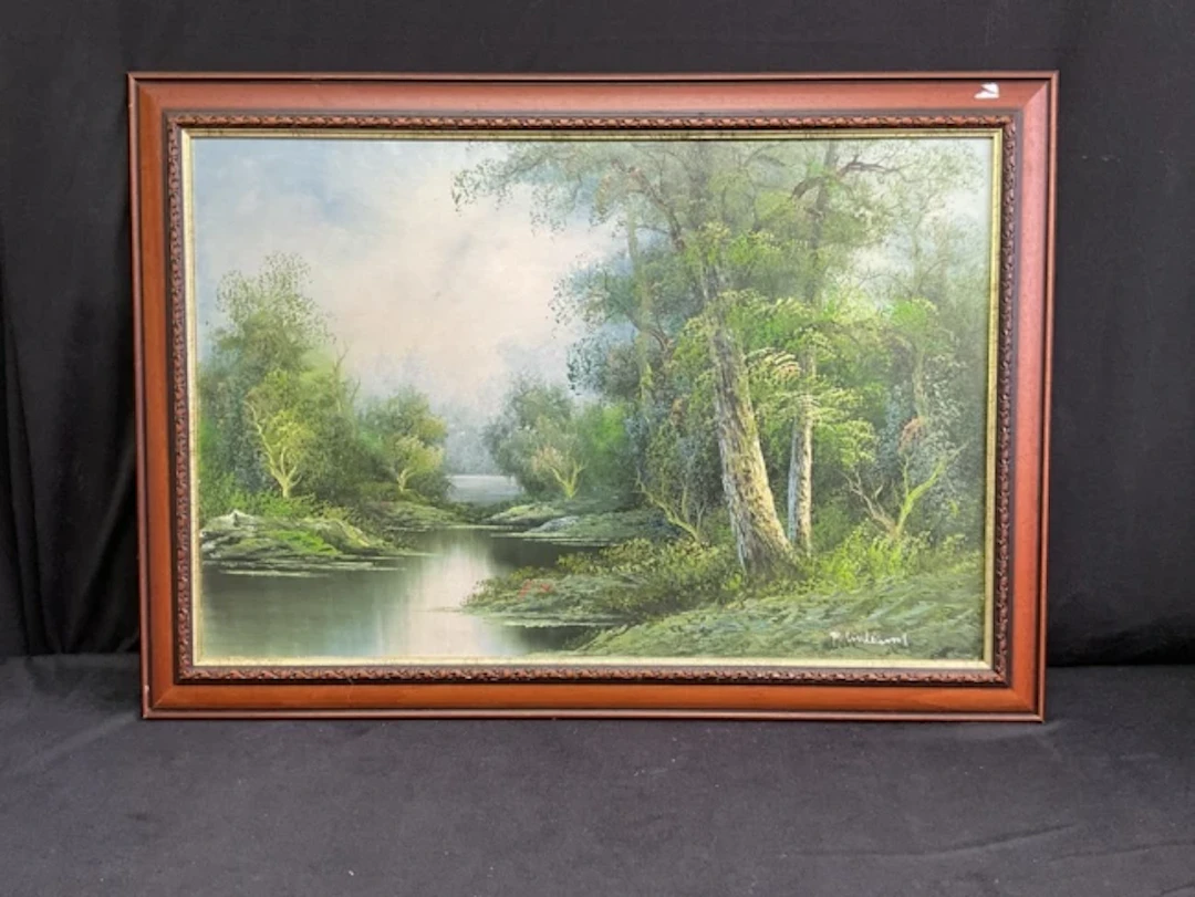 P Williams, oil on board, a wooded riverscape, signed & framed. (29.5in