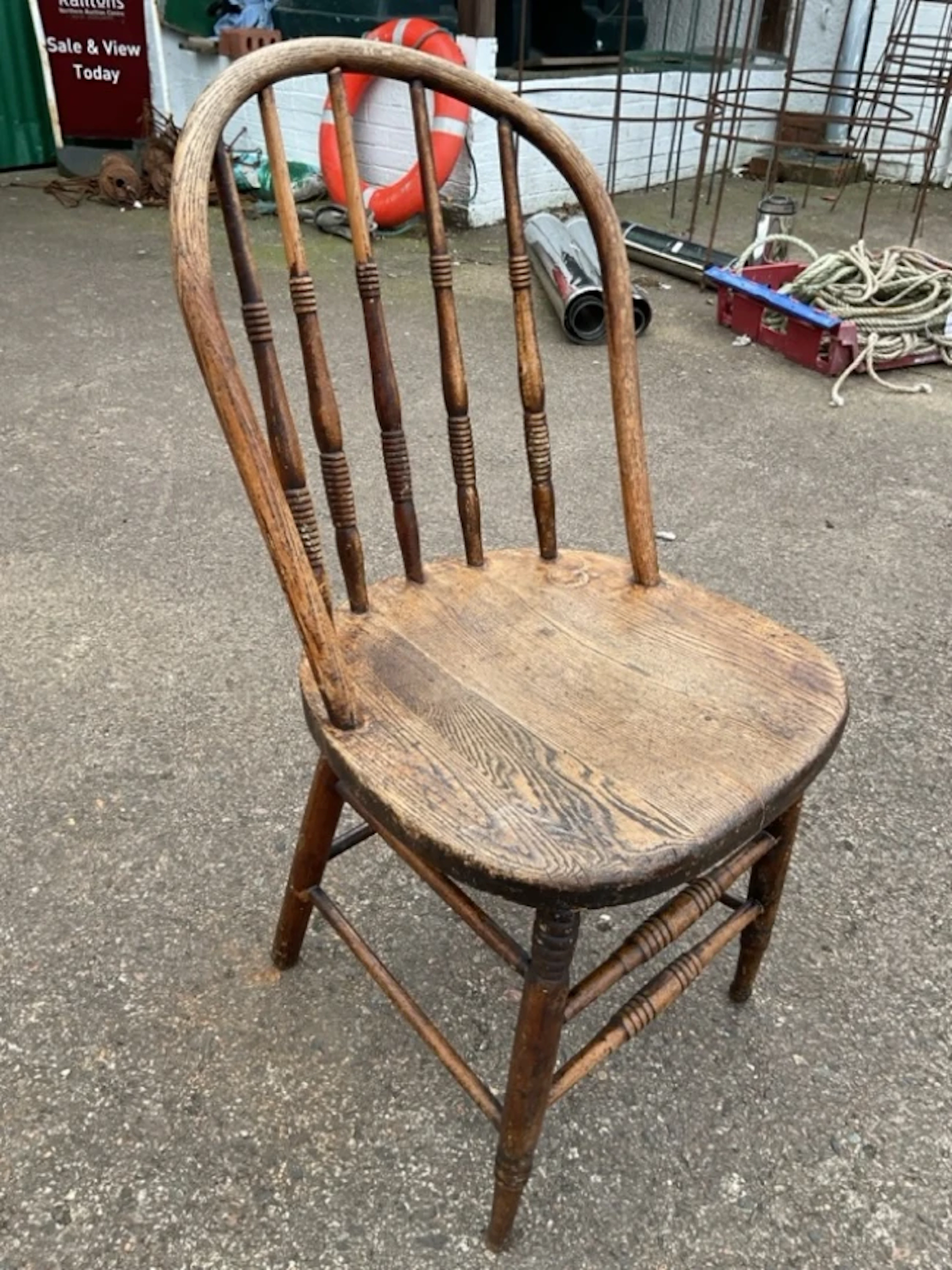 A country oak chair with hooped back on ring-turned spindles and legs