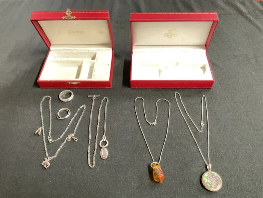 Two Cartier leather jewellery boxes with a silver mounted abalone