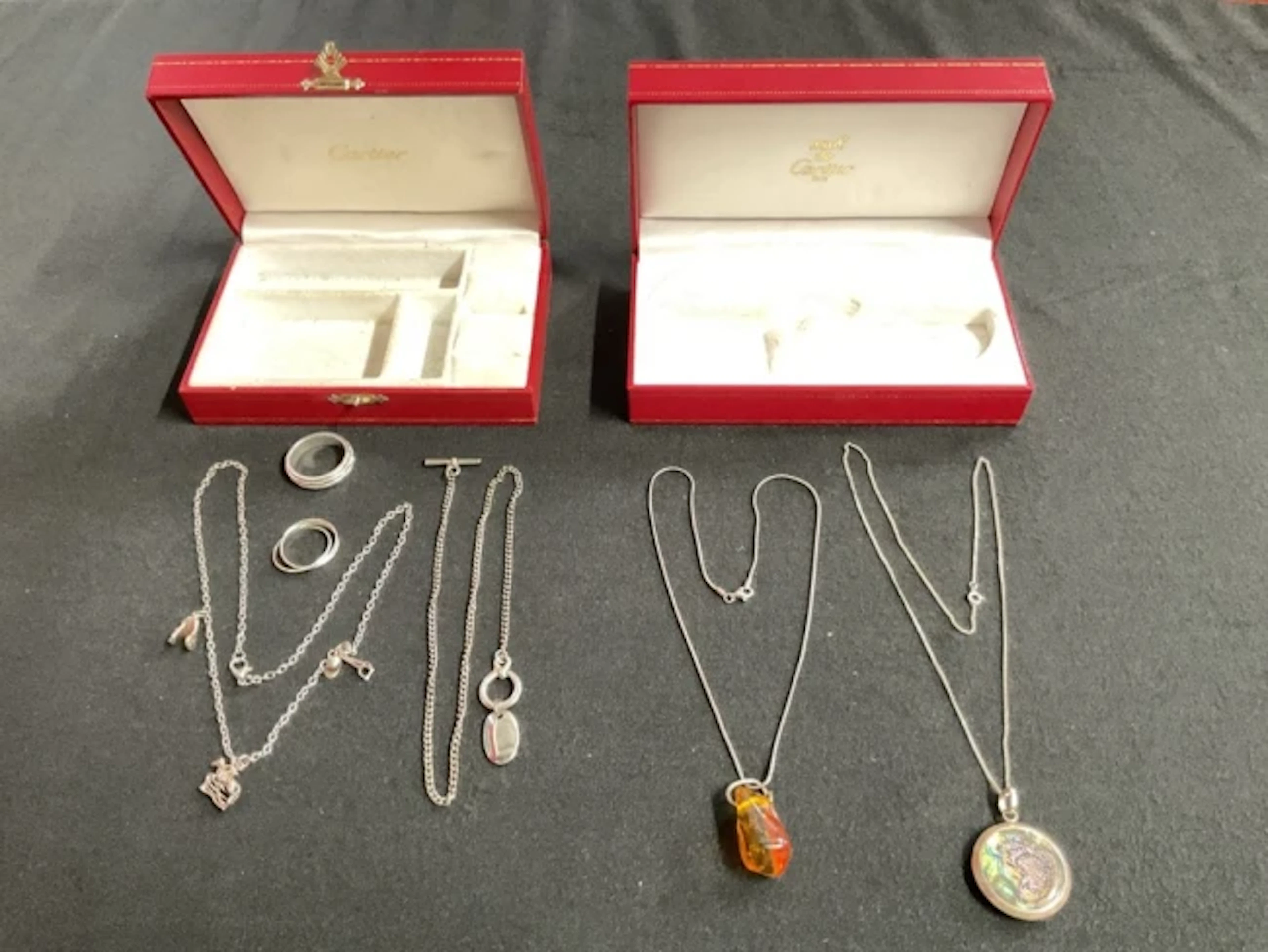 Two Cartier leather jewellery boxes with a silver mounted abalone