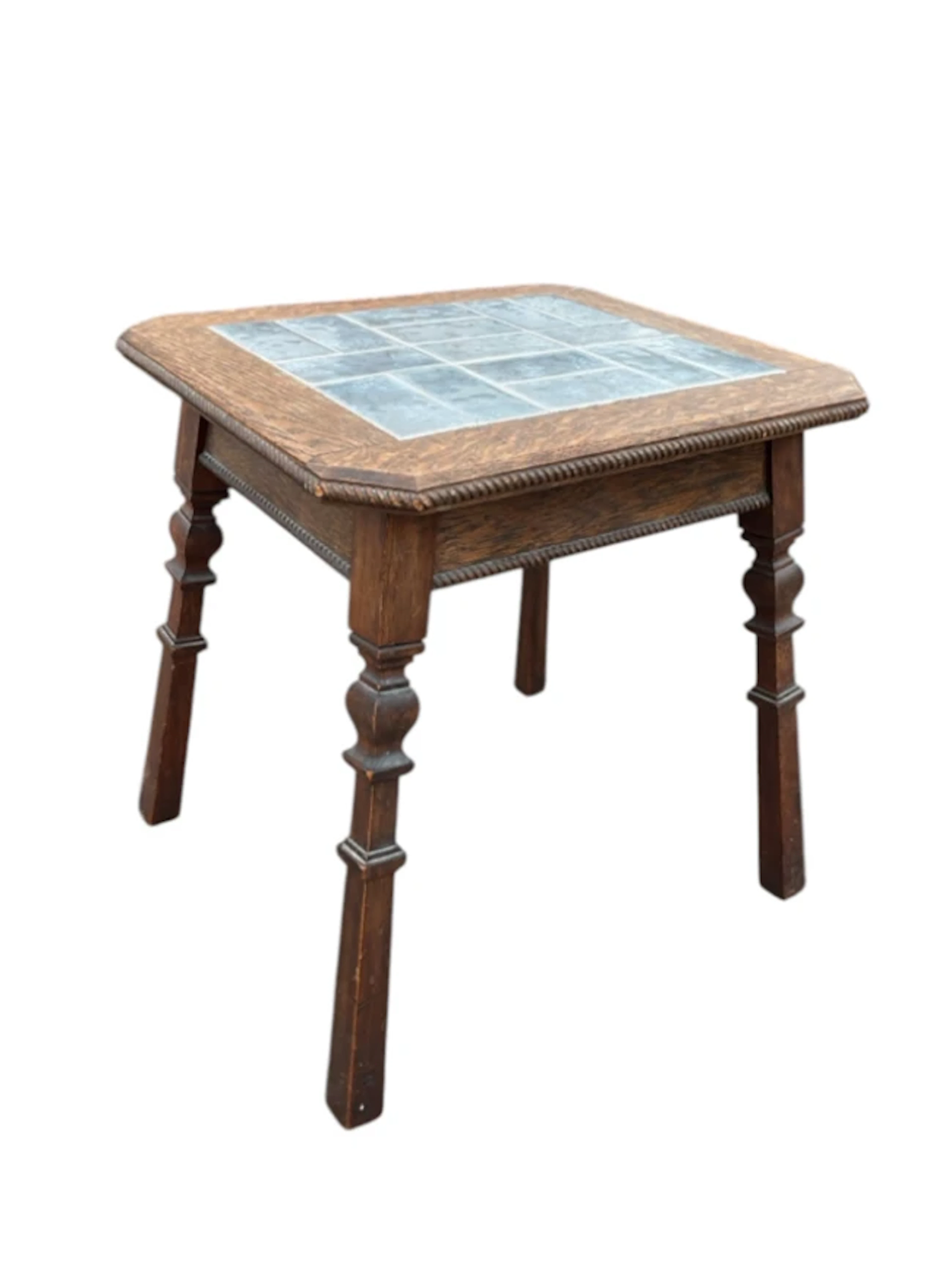 An Edwardian oak coffee table with square ropetwist moulded top inset