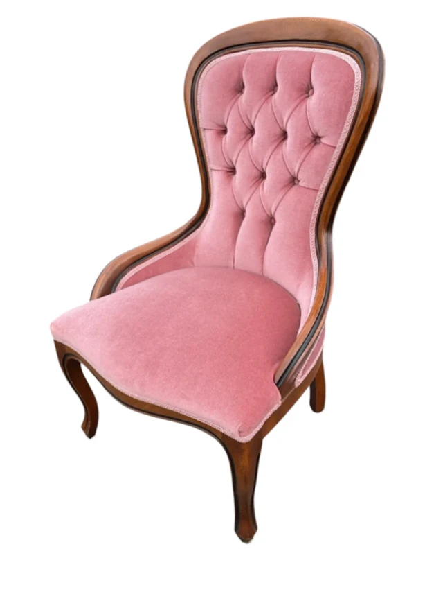 A reproduction button upholstered Victorian style chair with waisted