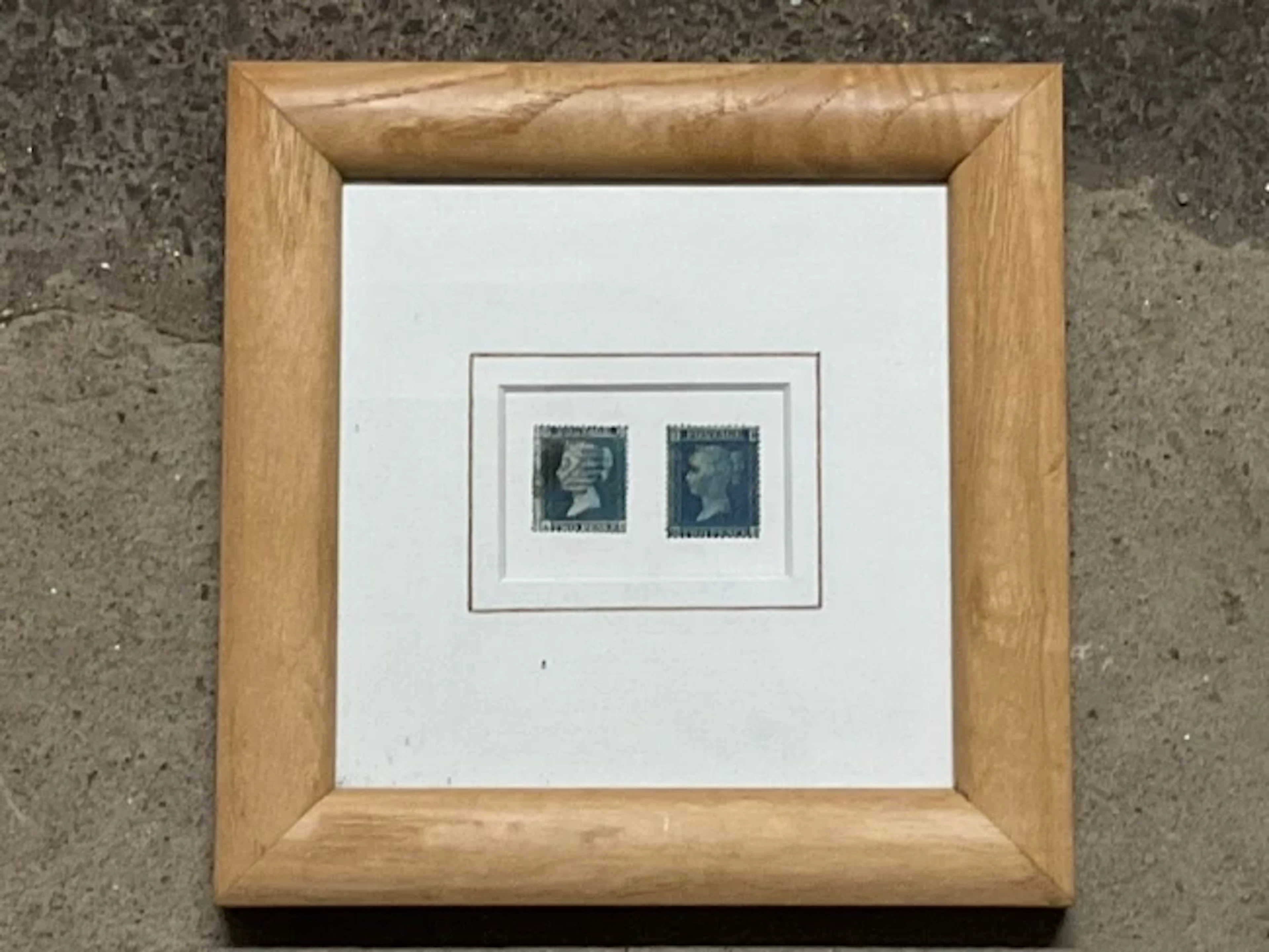 Two 1850s 2d blue postage stamps, smaller and larger perforated variations