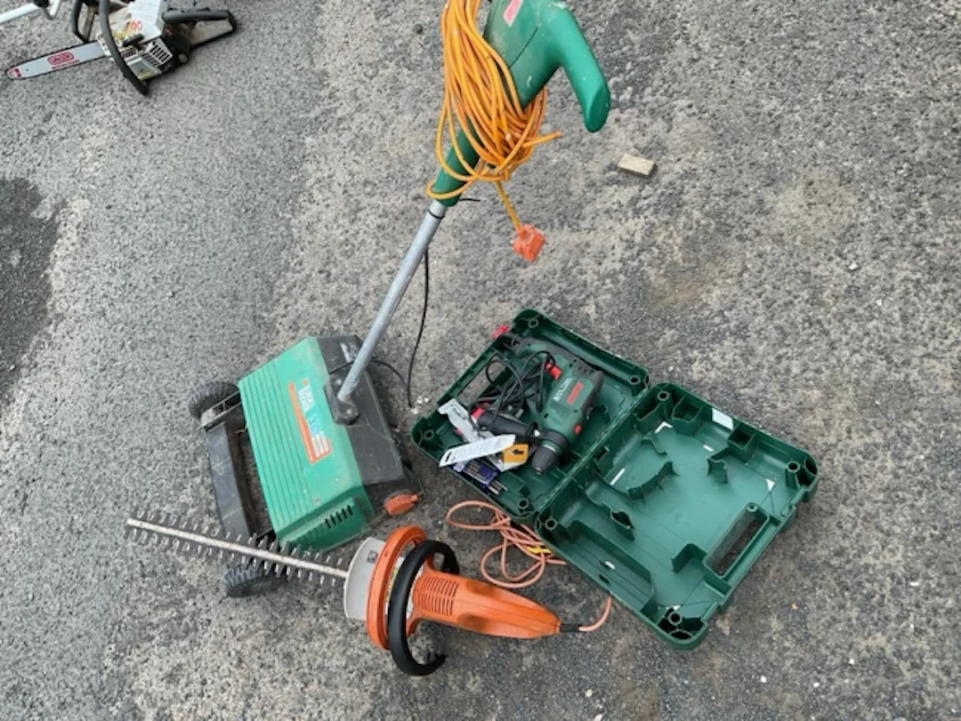 A Stihl electric powered chainsaw; a boxed Bosch hammer power drill