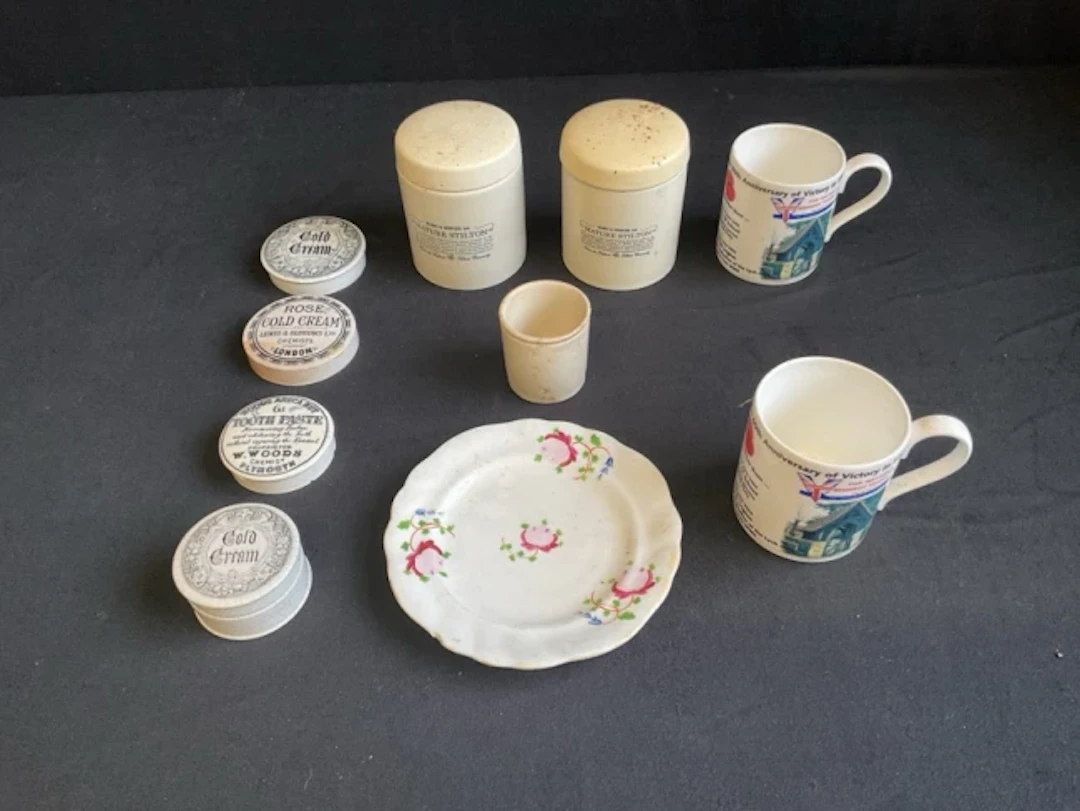 A Victorian stoneware cold cream pot with printed lid, three similar