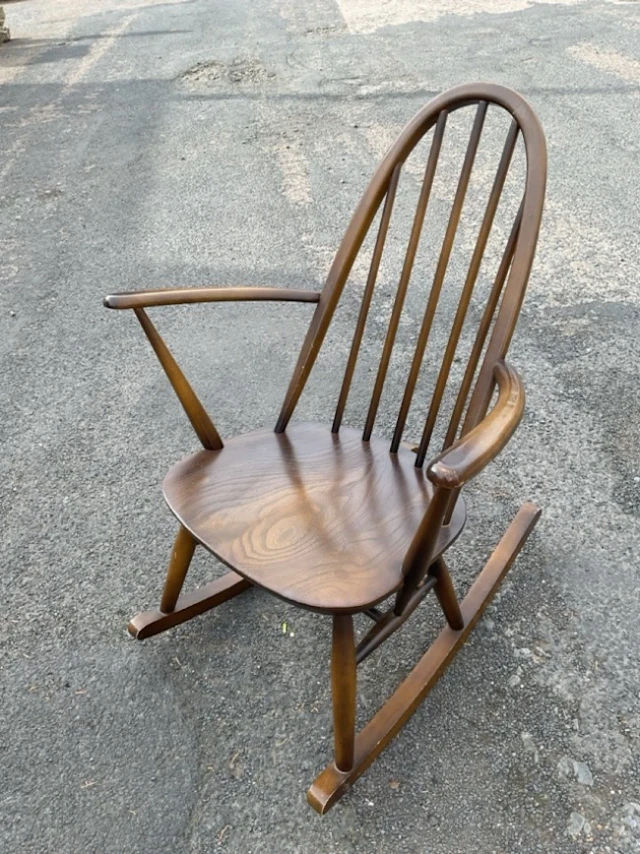 An Ercol rocking chair with hooped spindleback and flared rounded