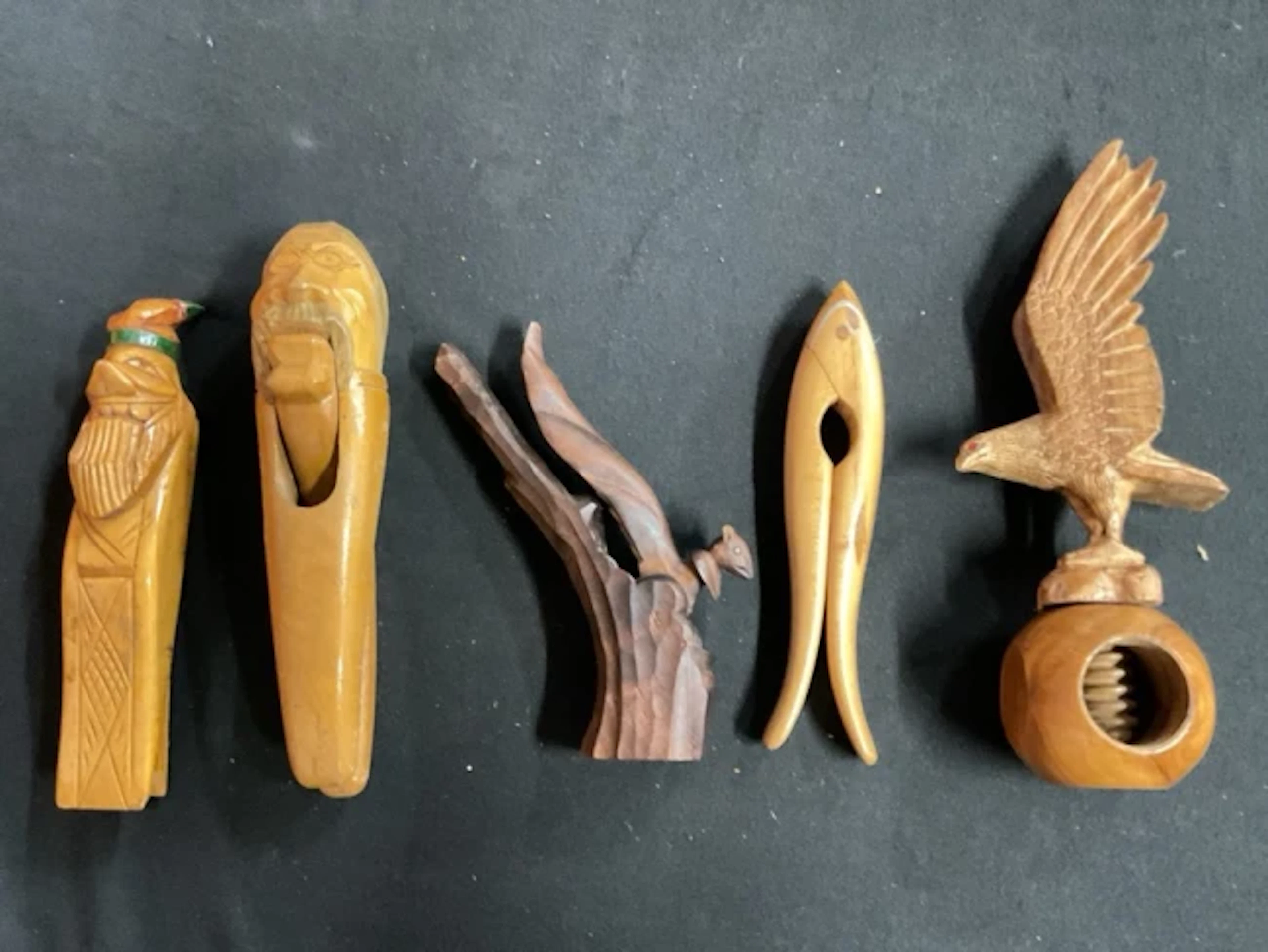 Five hand carved nut crackers - two birch gnome heads with articulated