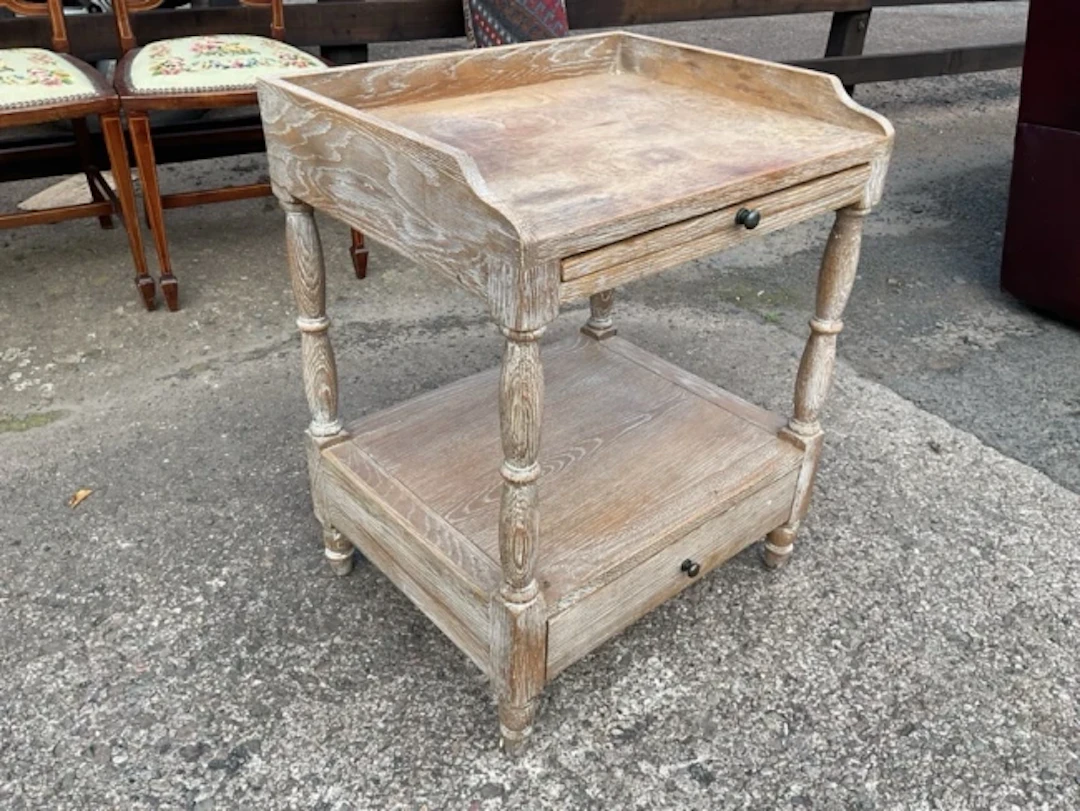 A limed oak washstand with shaped upstand to rectangular top, above