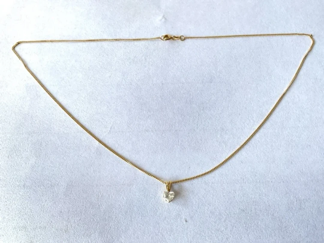 An 18ct gold diamond necklace, the heart shaped stone of approximately