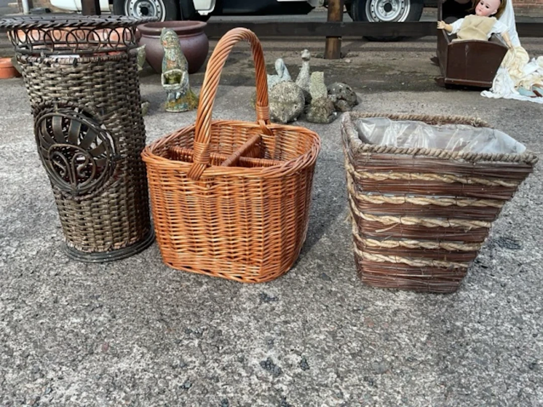 A metal faux-cane stickstand with flared collar having ropetwist rim;
