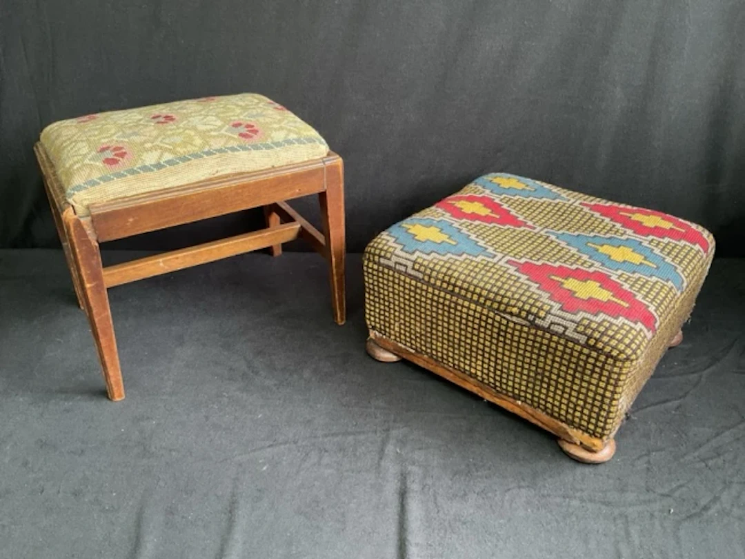A rectangular stool with floral tapestry drop-in seat in moulded frame