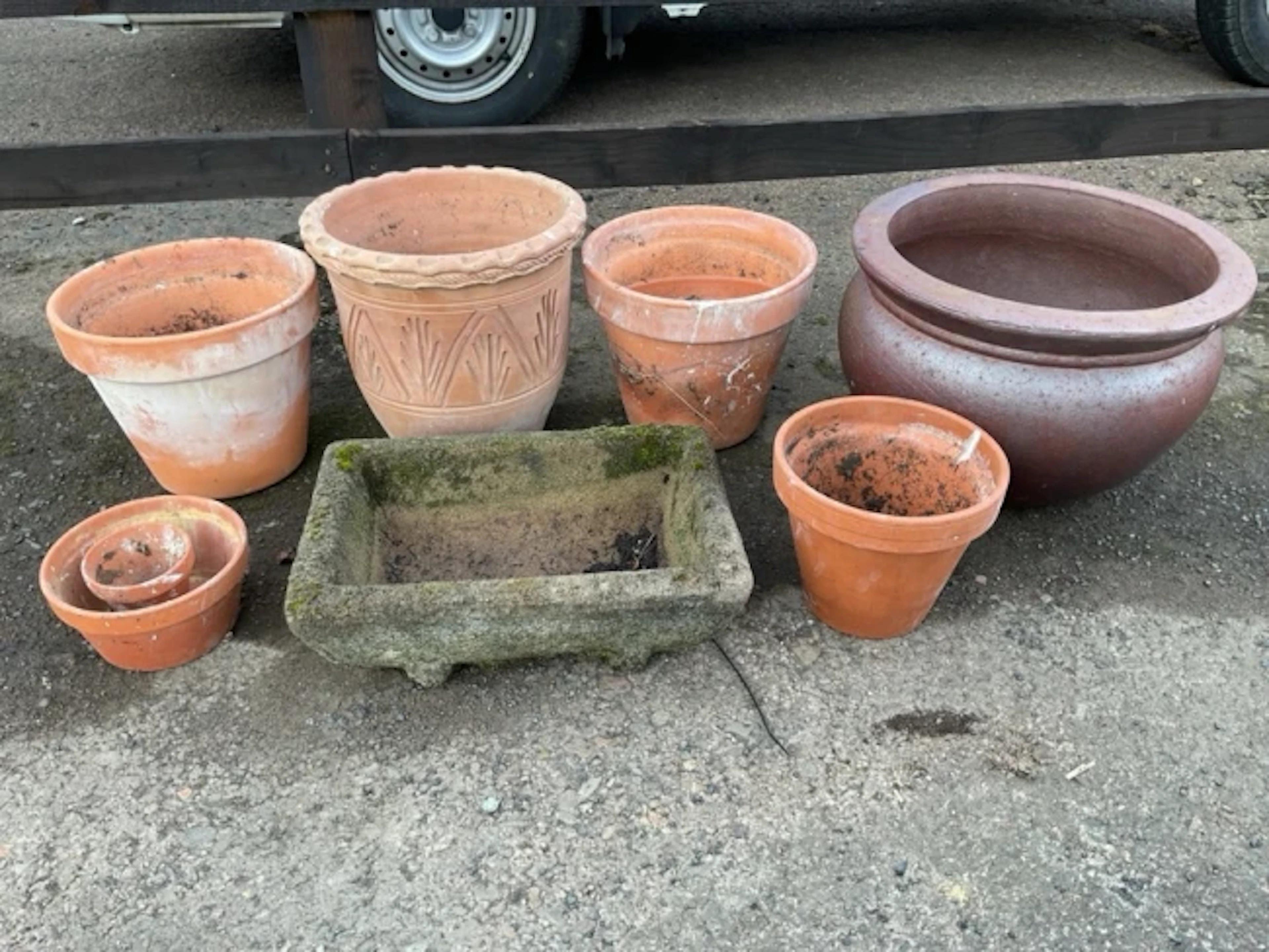 A rectangular composition stone garden trough; a large basin shaped