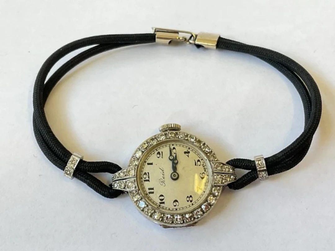 A deco platinum & diamond cocktail watch by Reid & Son, the case and