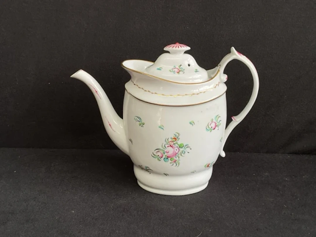 An early C19th New Hall porcelain navette shaped coffee pot with domed