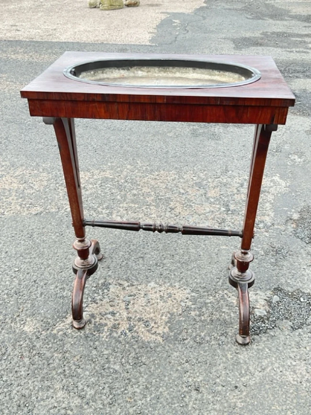 A William IV rosewood crocus table with rectangular top and recessed