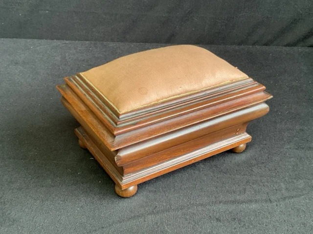 A late Victorian mahogany sewing box with pin cushion to hinged moulded