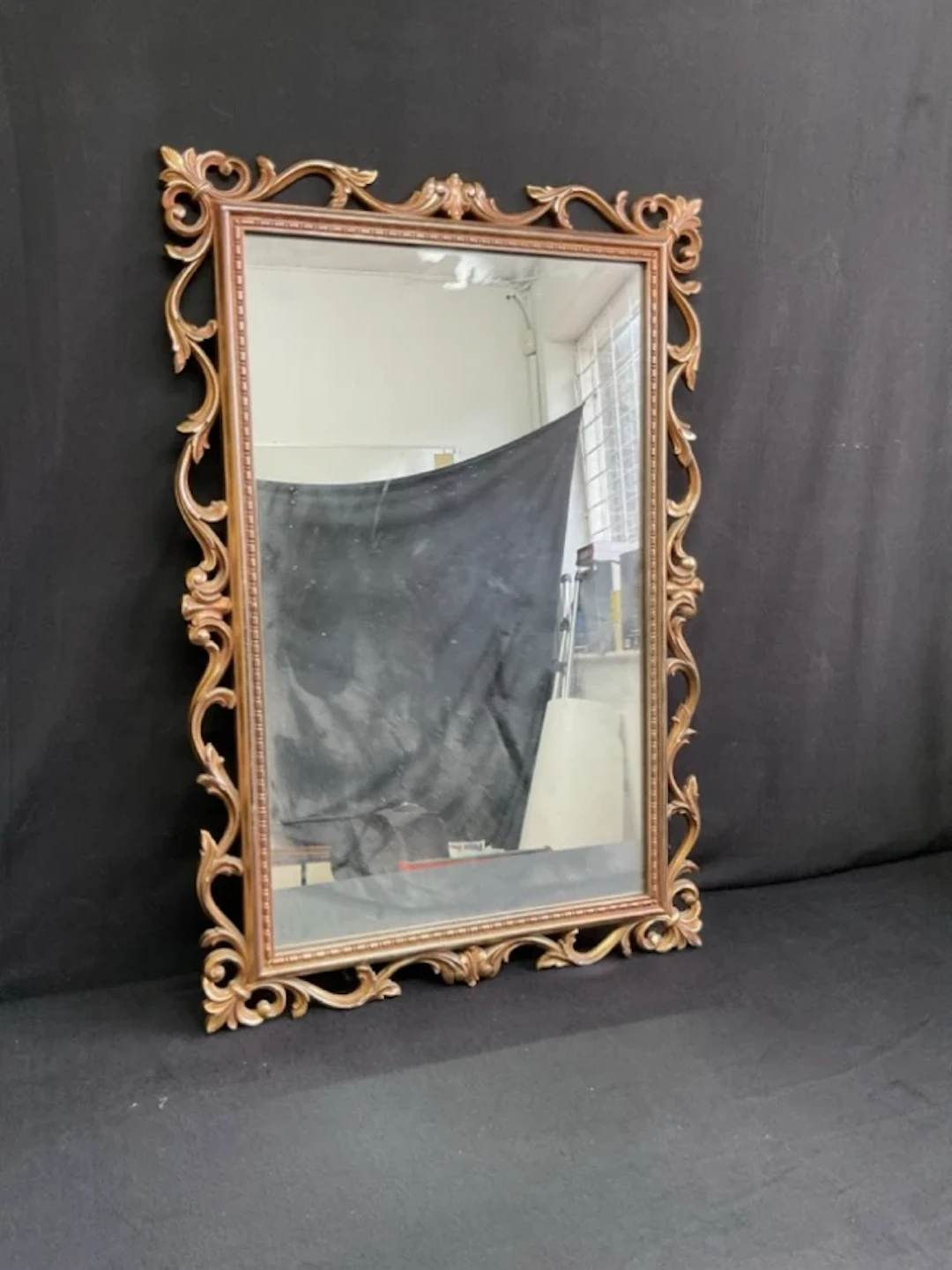 A Georgian style rectangular mirror with rococo pierced foliate scroll