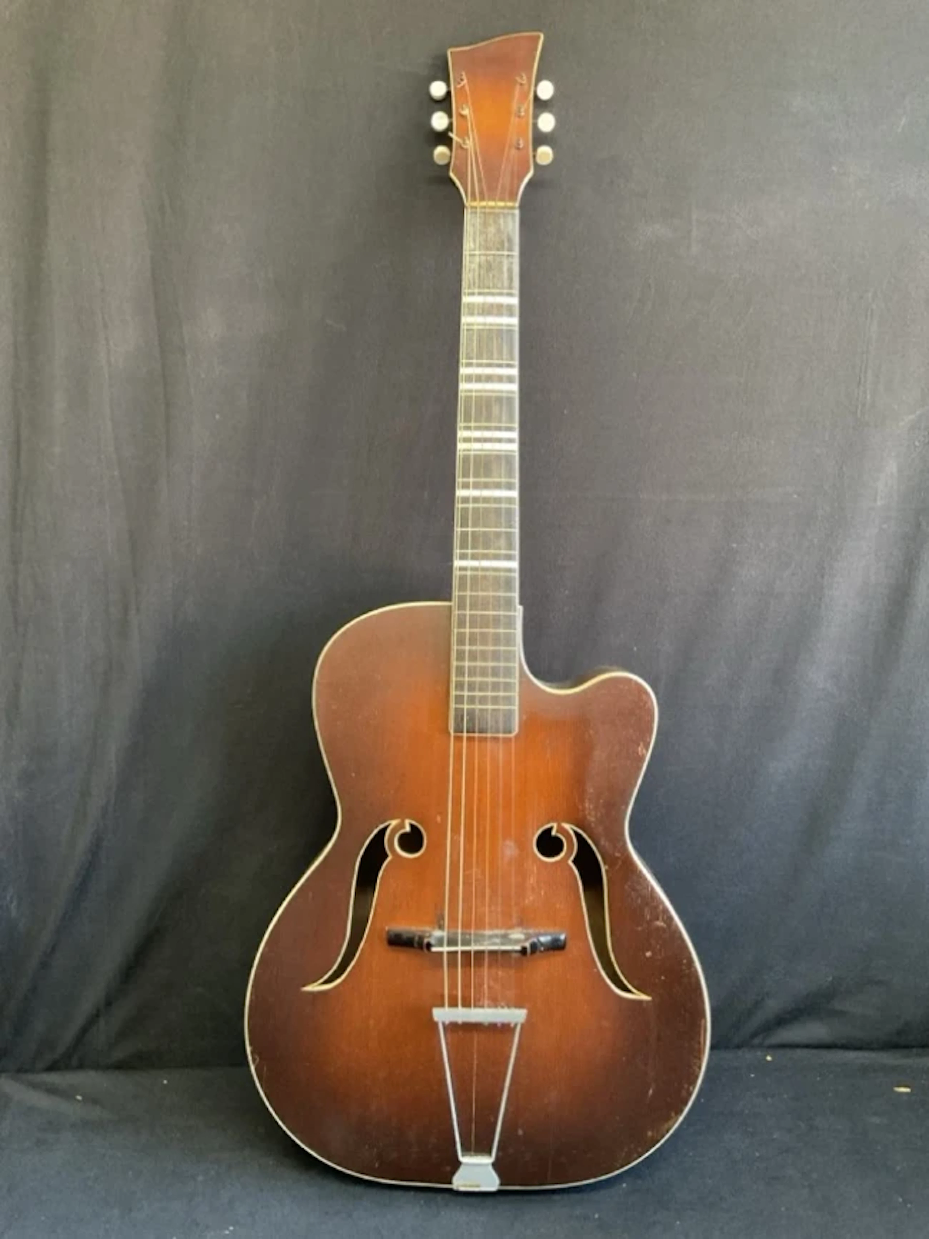 A 60s Melodija arched top acoustic guitar with ebonised neck, shaped