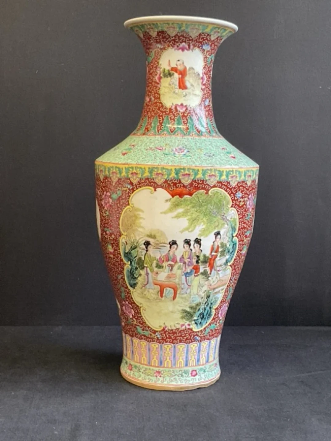 A large Chinese porcelain vase painted with panels of court ladies