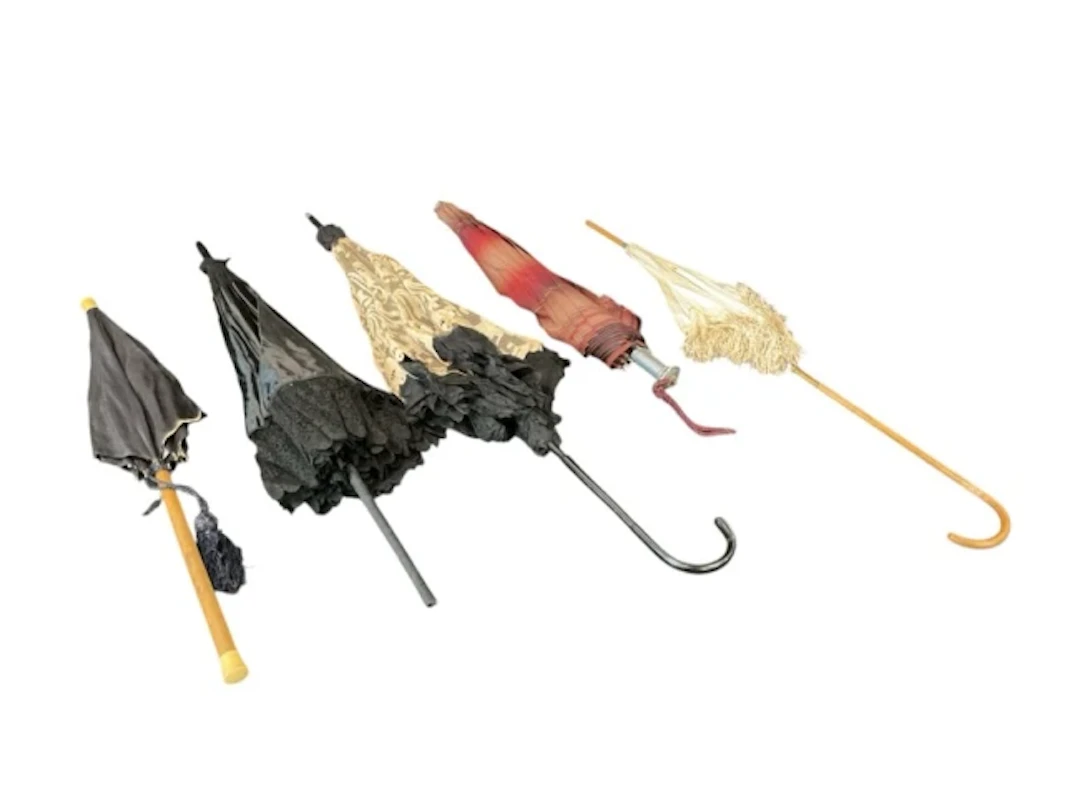 Four Edwardian ladies parasols - black silk with tassel and cylindrical
