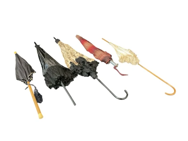 Four Edwardian ladies parasols - black silk with tassel and cylindrical