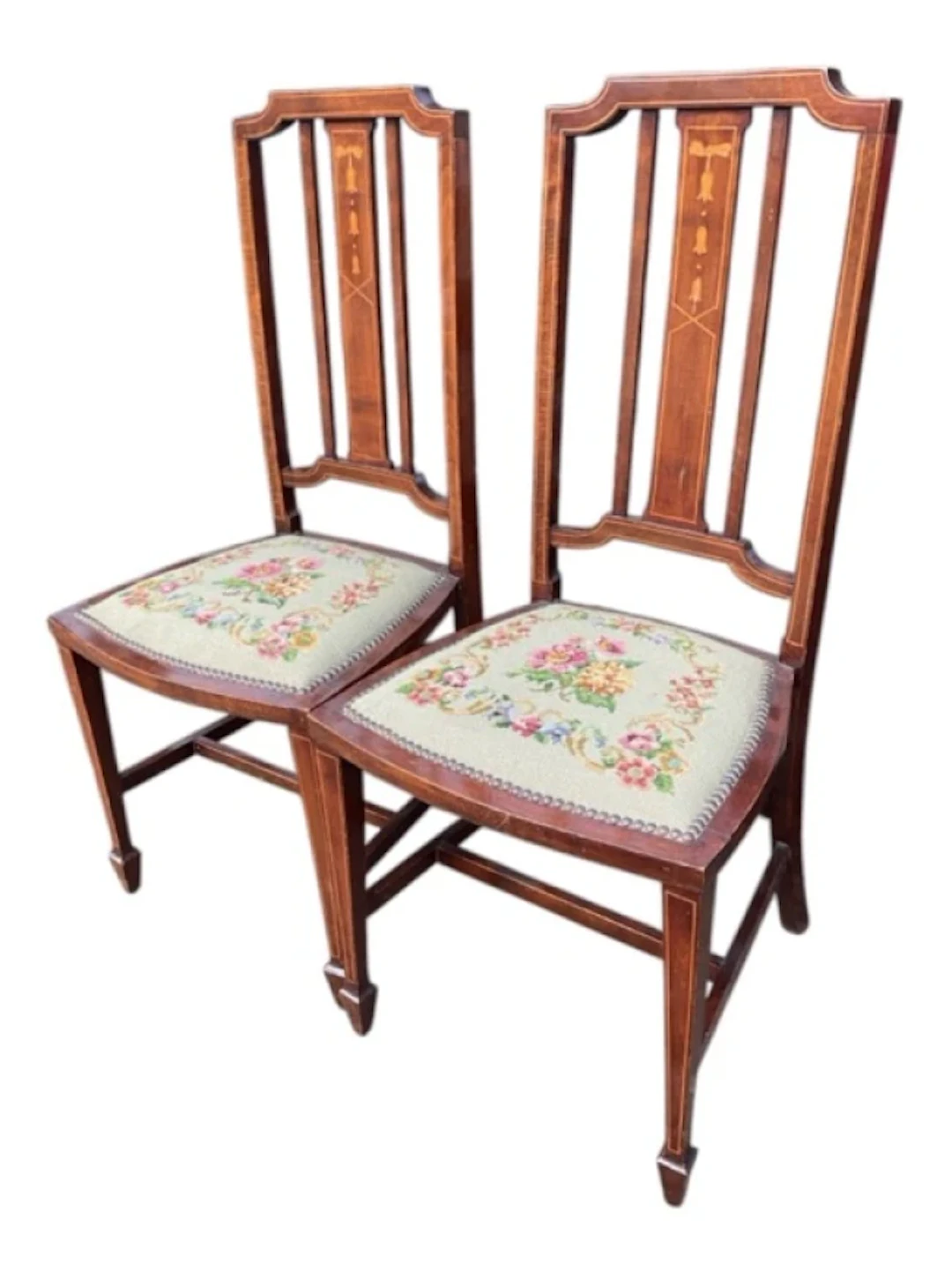 A pair of Edwardian mahogany chairs inlaid with boxwood stringing