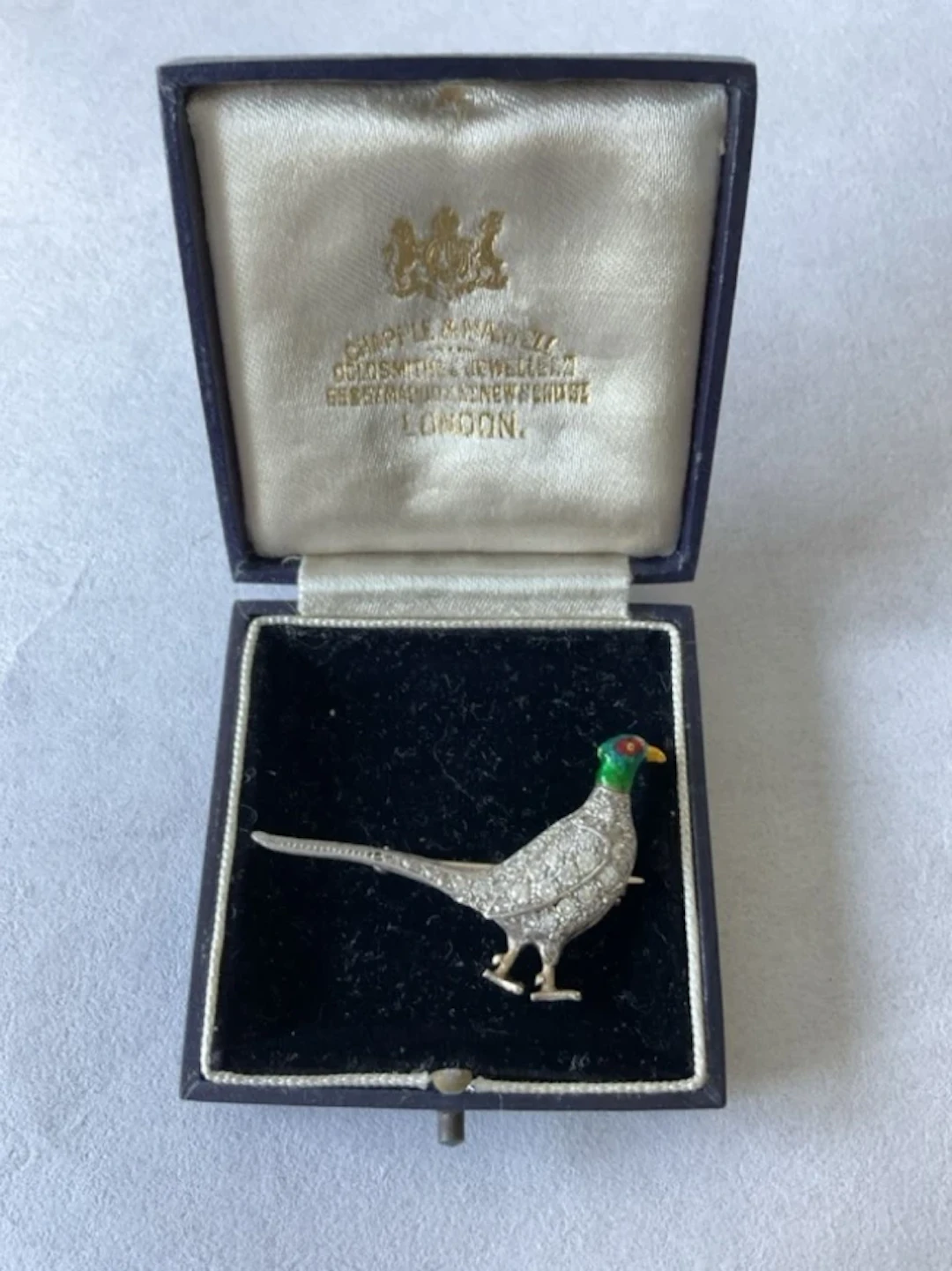 An antique platinum brooch in the form of a pheasant, having enamelled