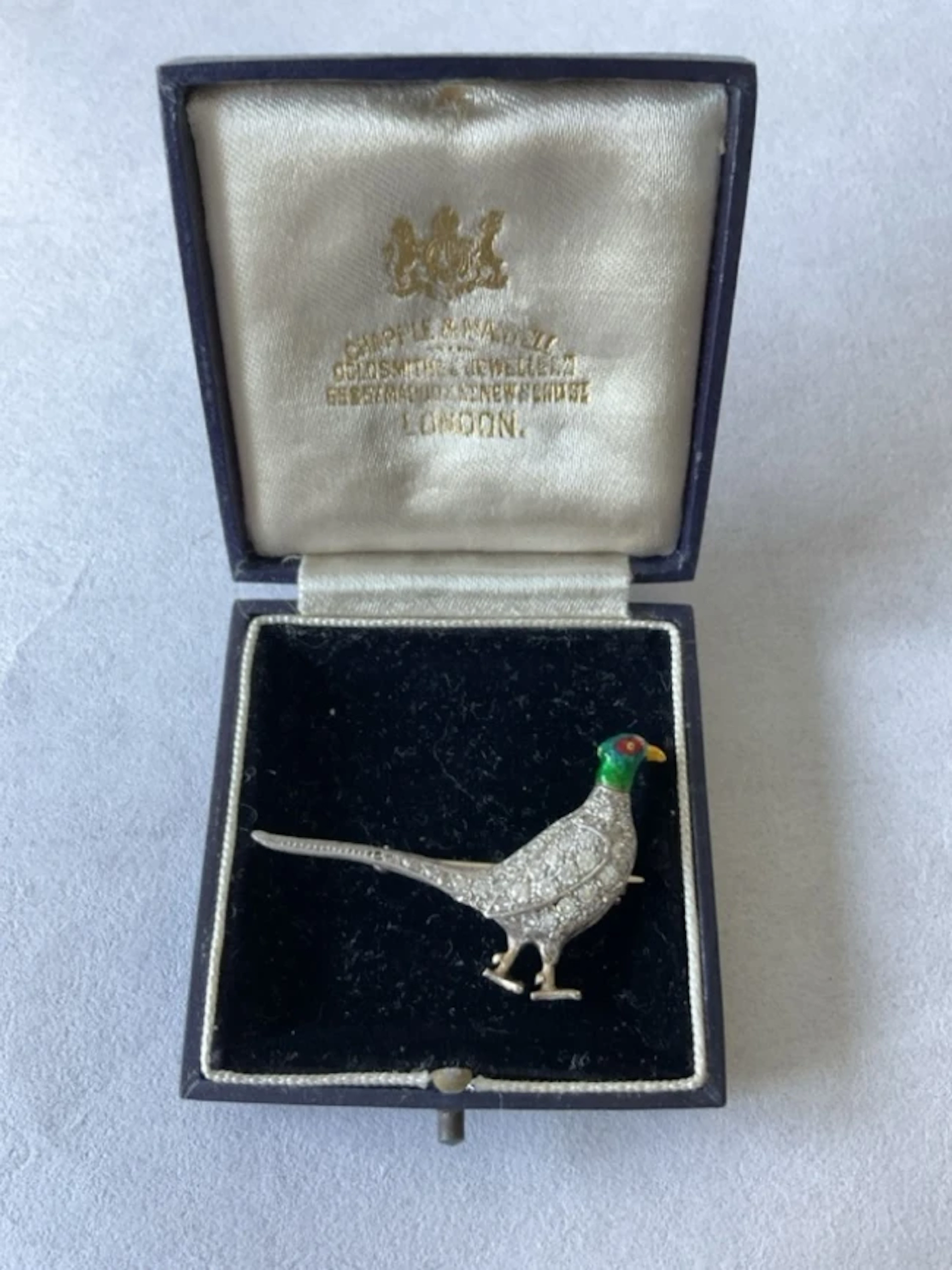 An antique platinum brooch in the form of a pheasant, having enamelled