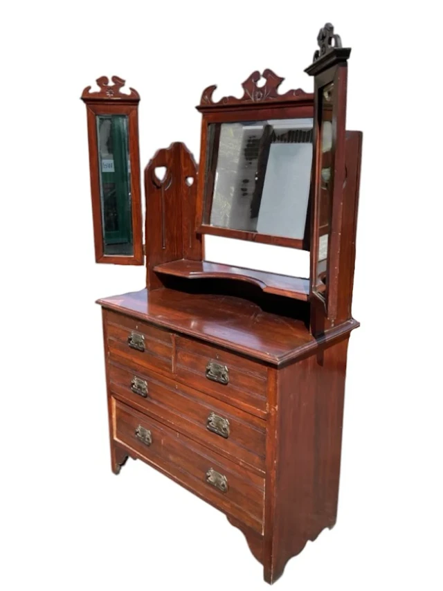 An Edwardian mahogany dressing table with fretwork crested mirrors