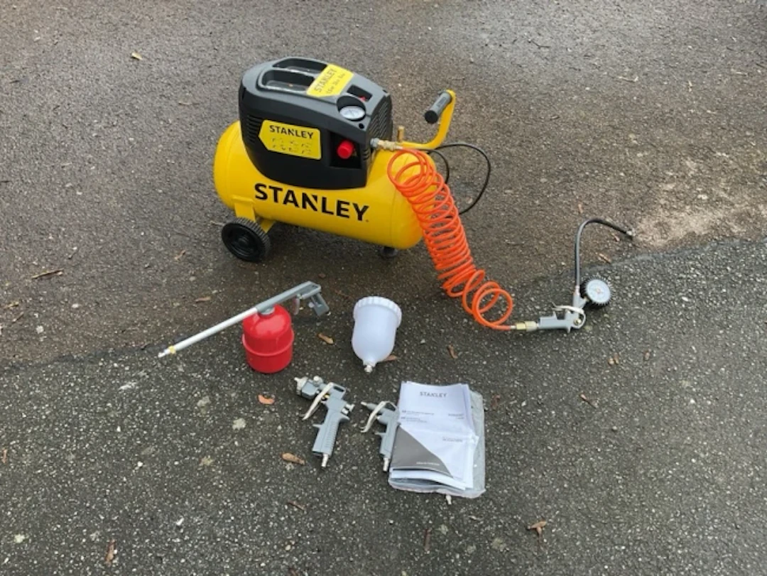 A Stanley air compressor- 1.5Hp, 24Lt, 8 Bar; with manual and accessories-