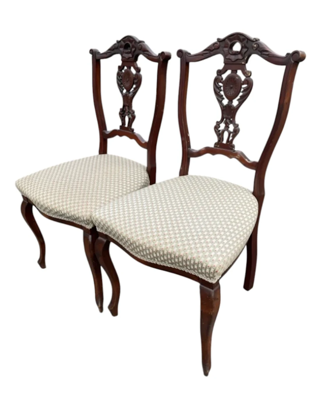 A pair of late Victorian mahogany chairs with pierced leaf carved