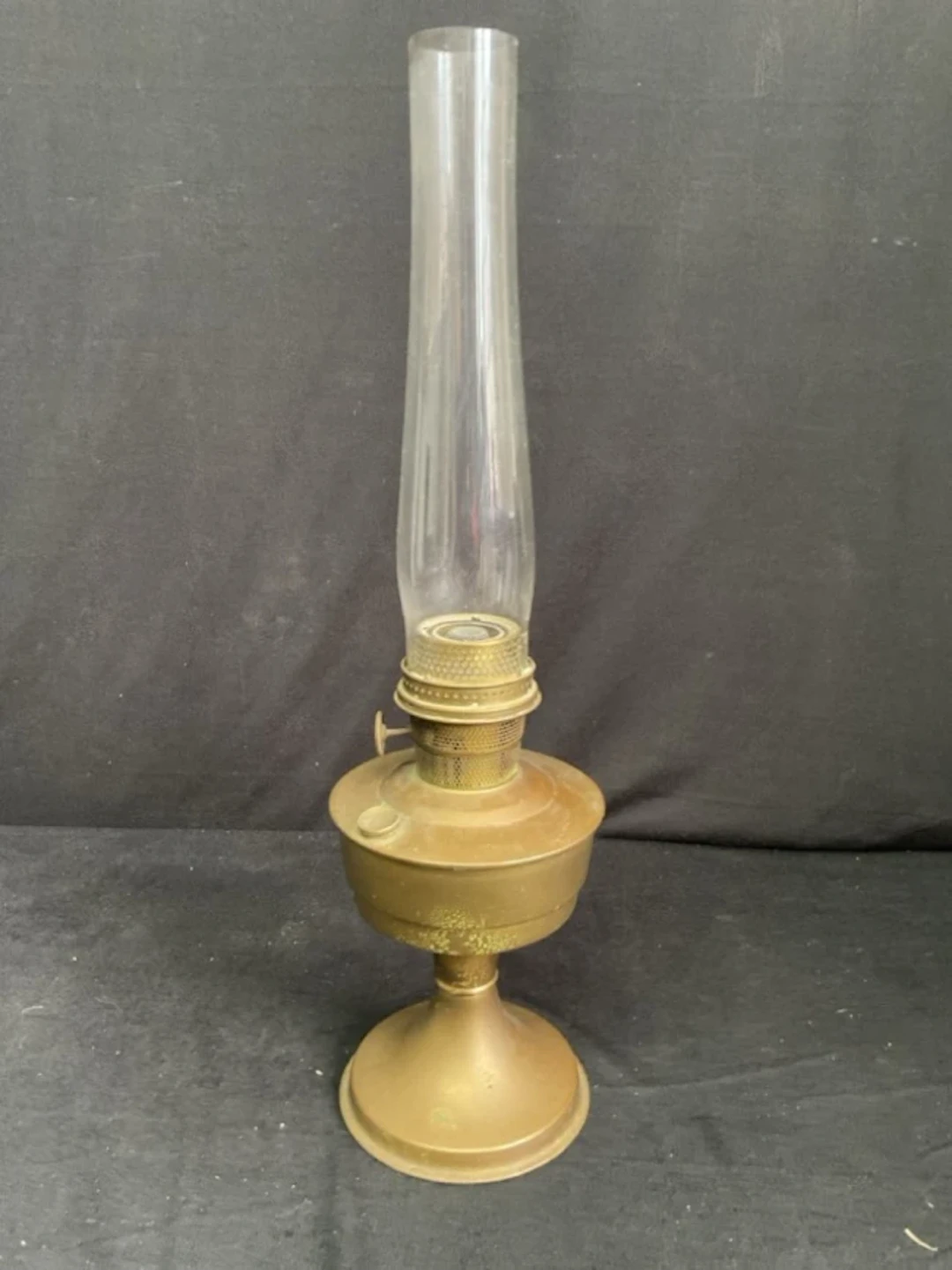 A 20s deco style Super Aladdin brass oil lamp with glass flue and