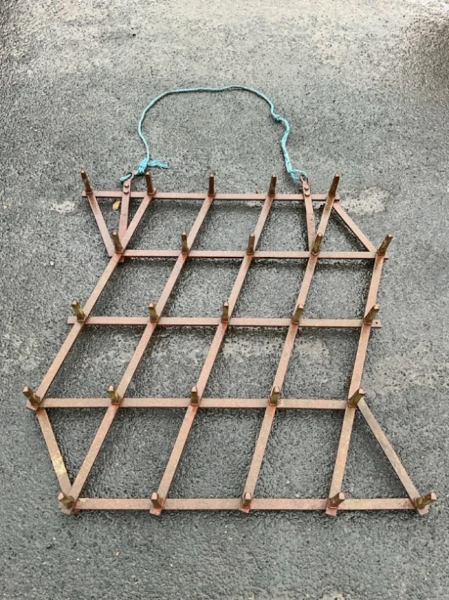 An agricultural harrow with twenty-five square tapering spear spikes