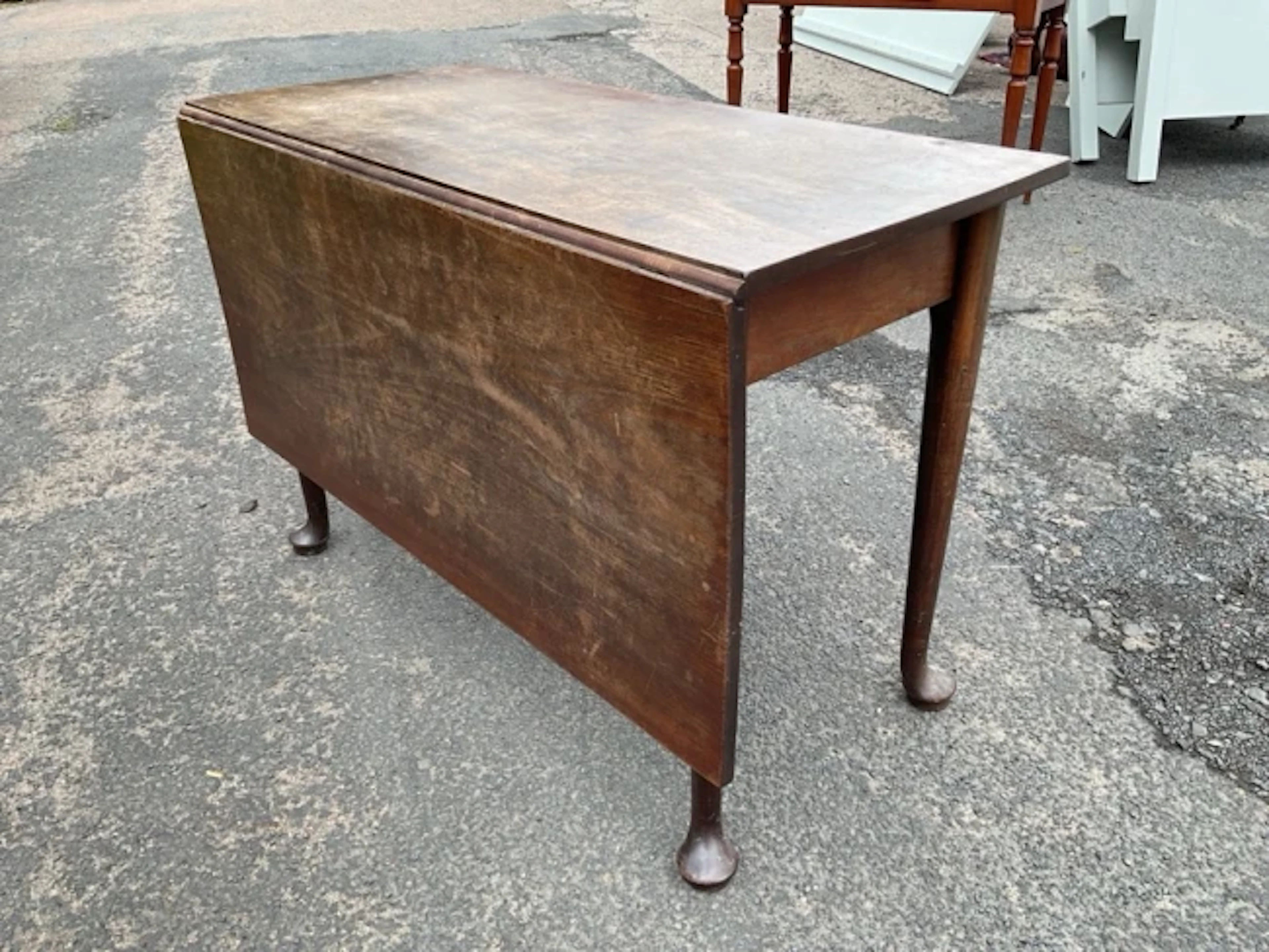 A Georgian mahogany dining table, the rectangular top with large single