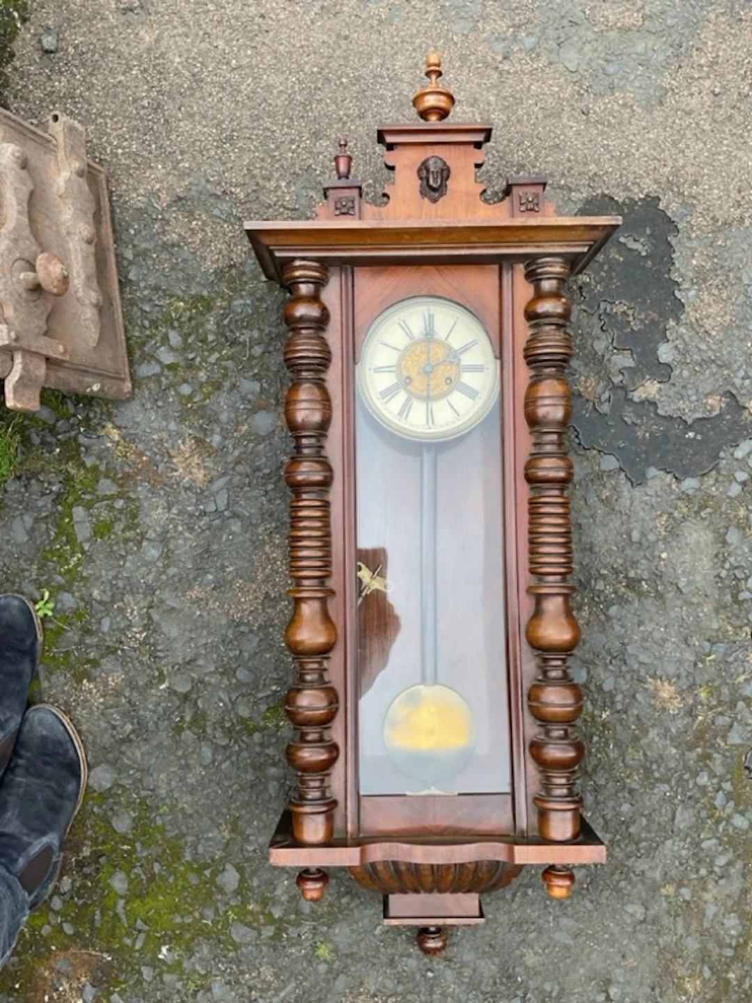A Victorian walnut Vienna style wall clock, the pediment with turned
