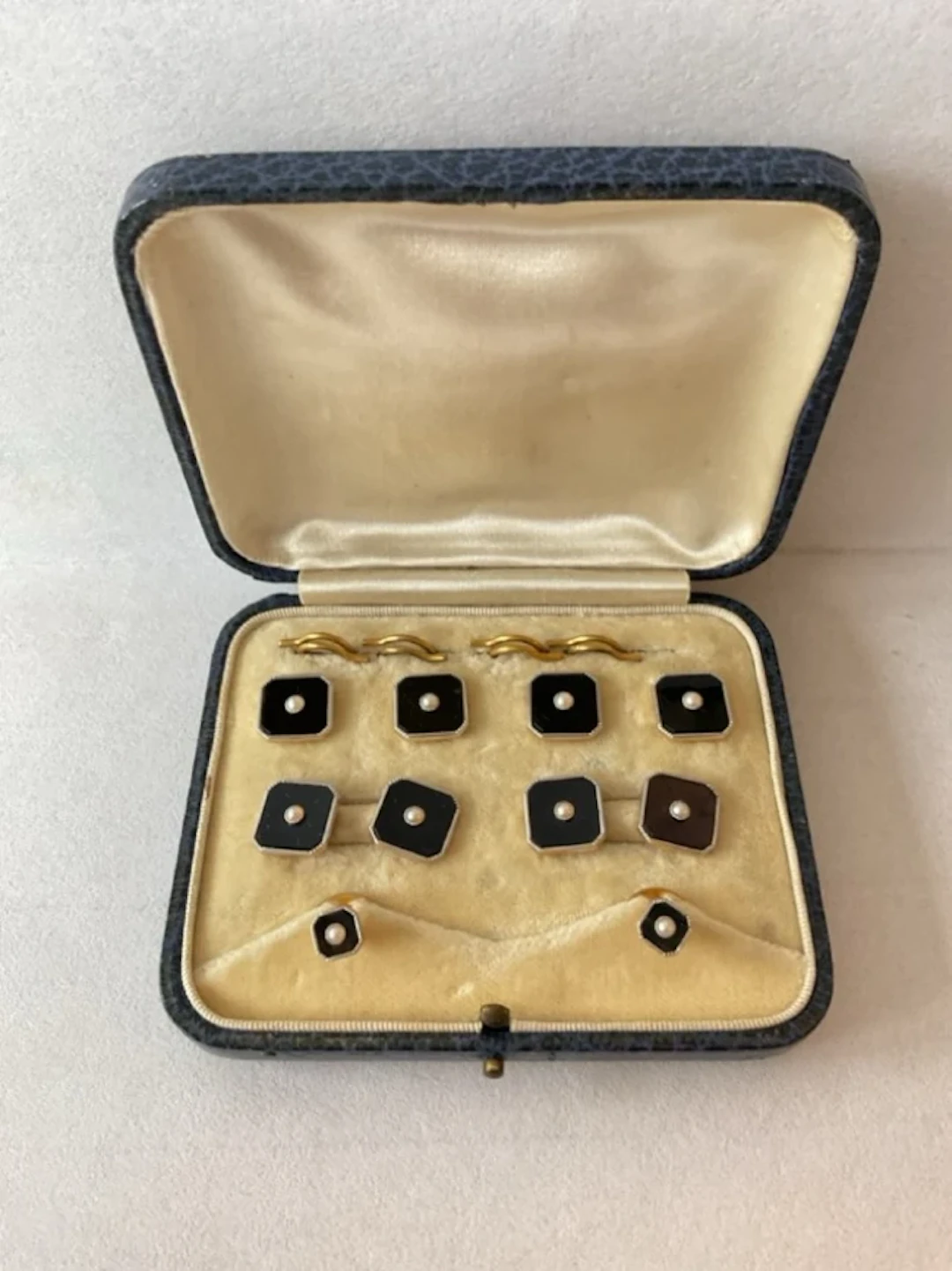 A cased set of 18ct gold & platinum studs and cufflinks, the square