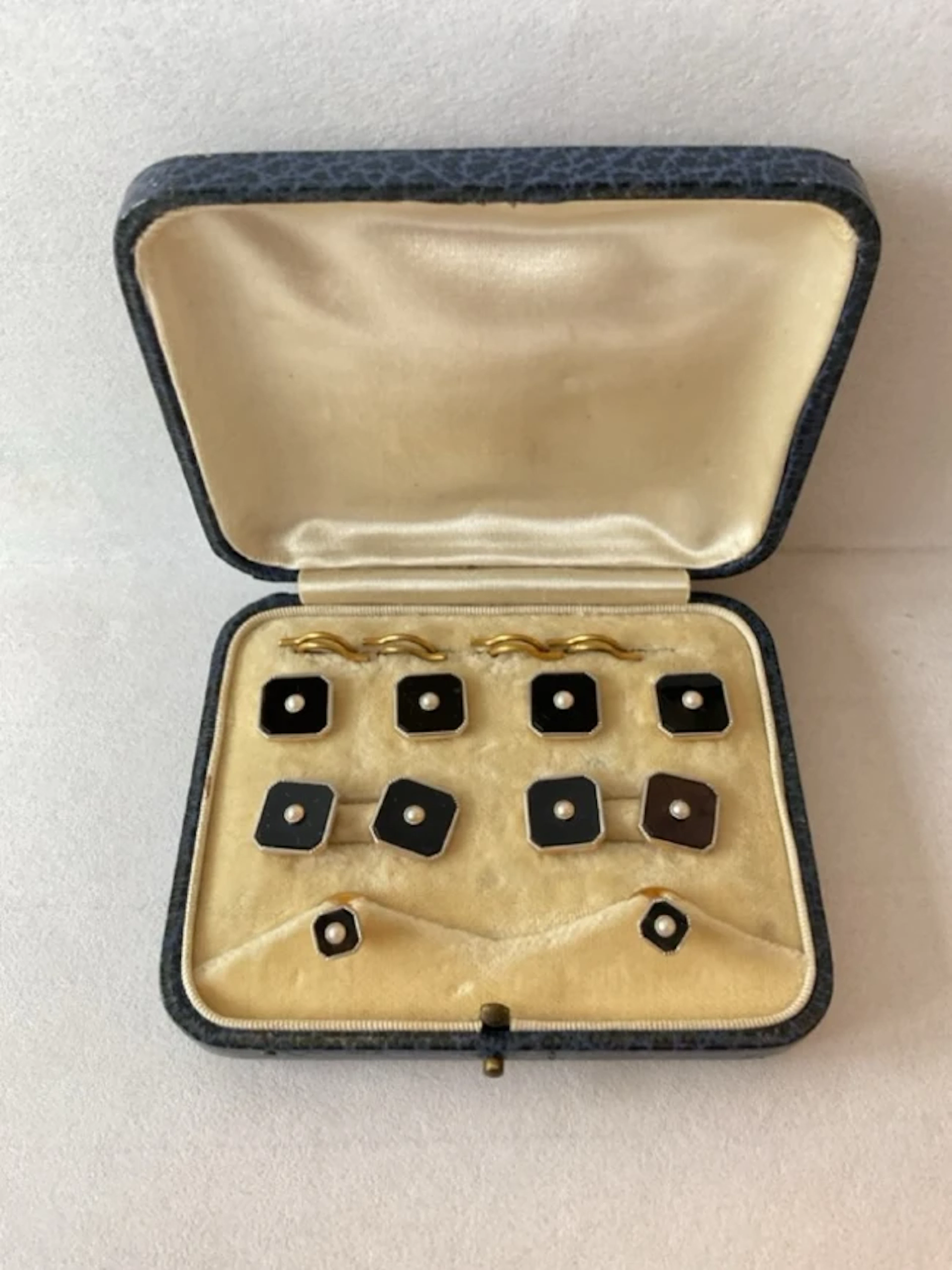 A cased set of 18ct gold & platinum studs and cufflinks, the square
