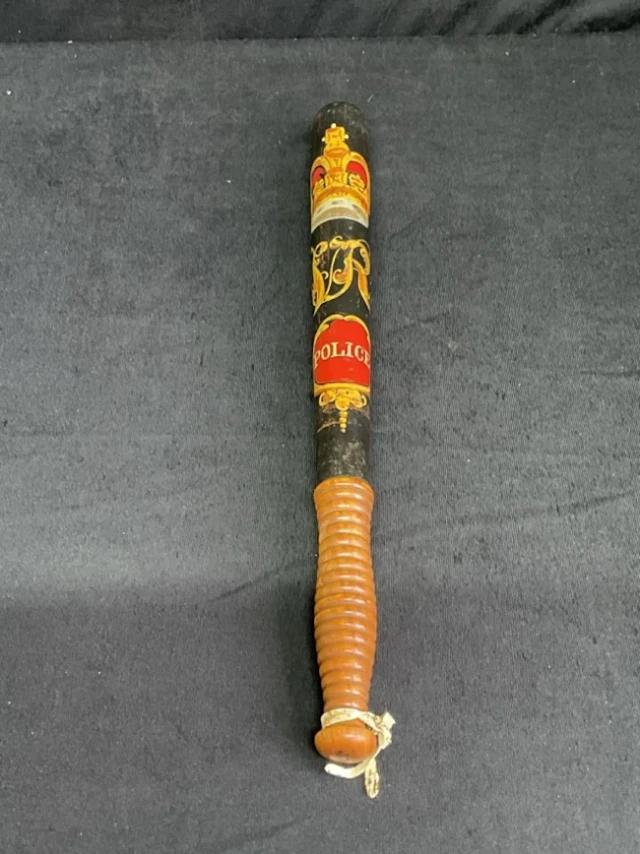 A Victorian turned boxwood truncheon with ribbed handle and tapering