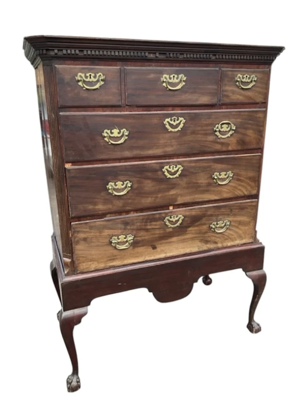 A Georgian mahogany chest on stand with moulded dentil cornice above