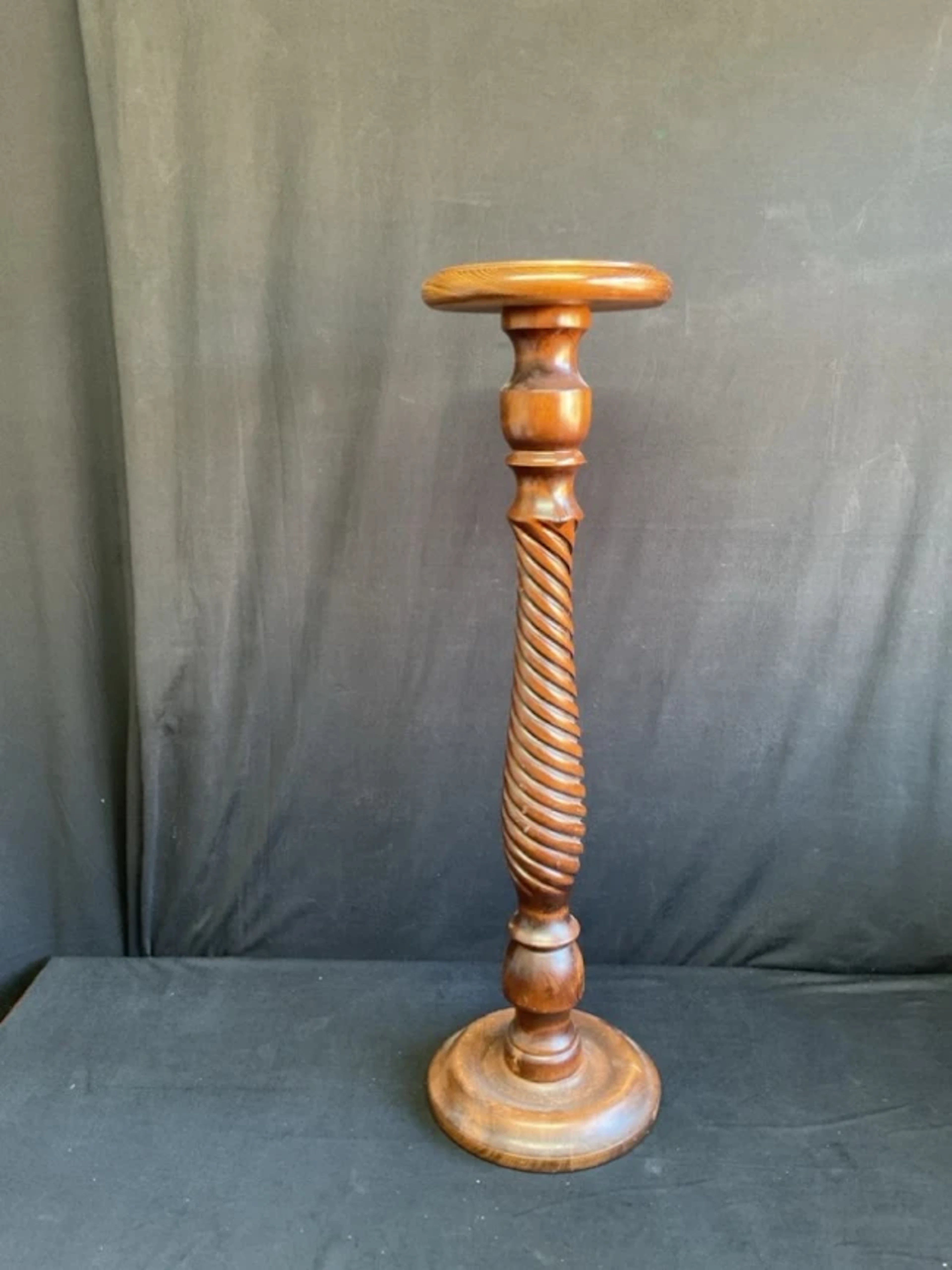 A Victorian style stained pine plant stand with circular top above