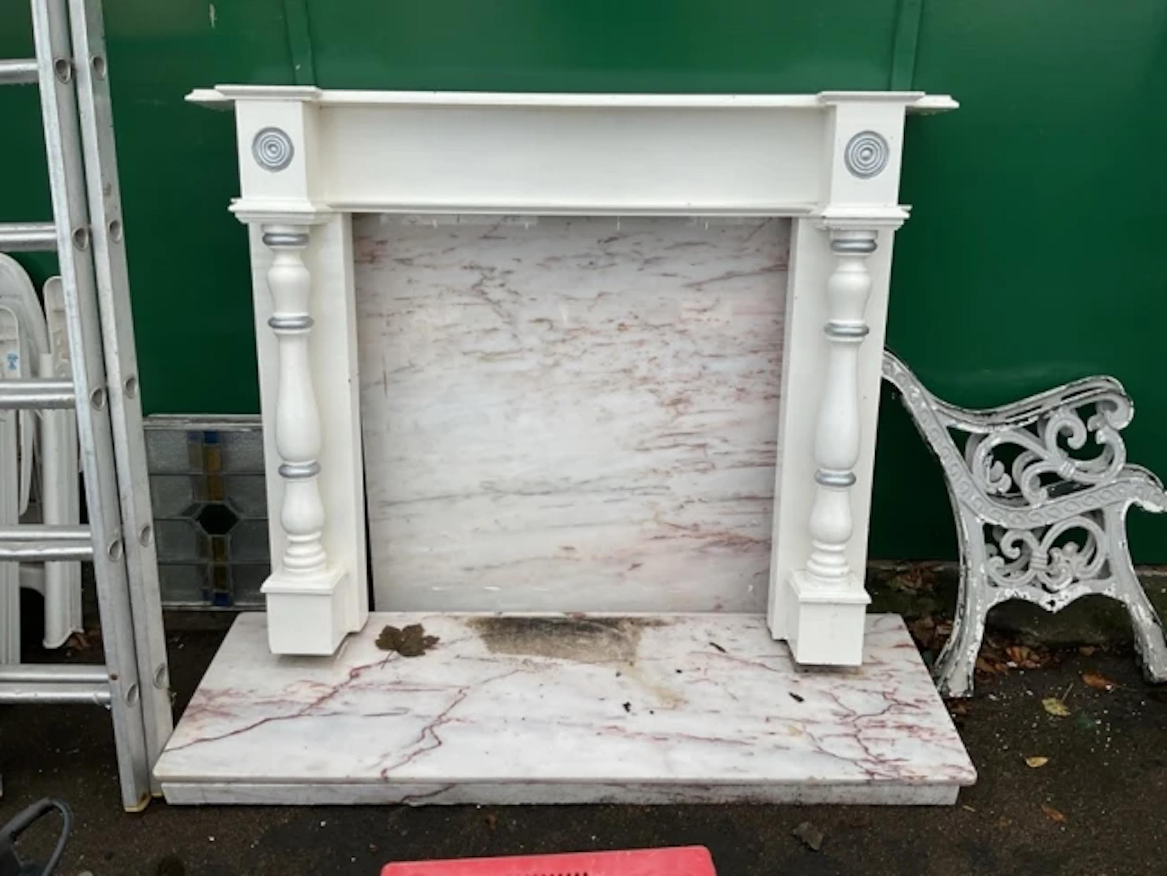 A Victorian style painted pine and marble fireplace with moulded mantel