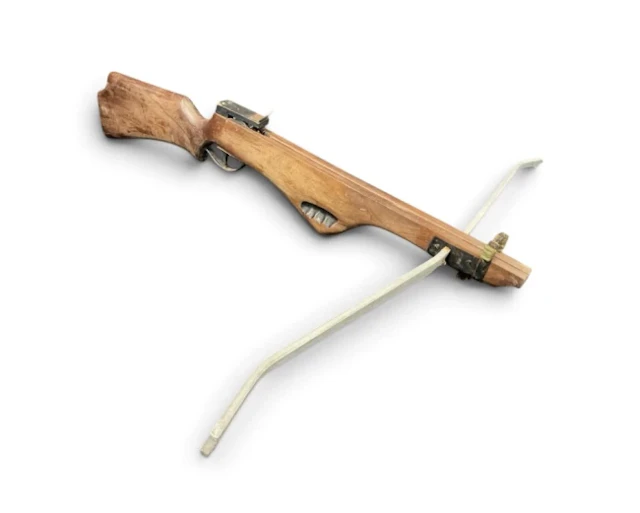 A crossbow with mahogany rifle style stock, having carved shaped foregrip