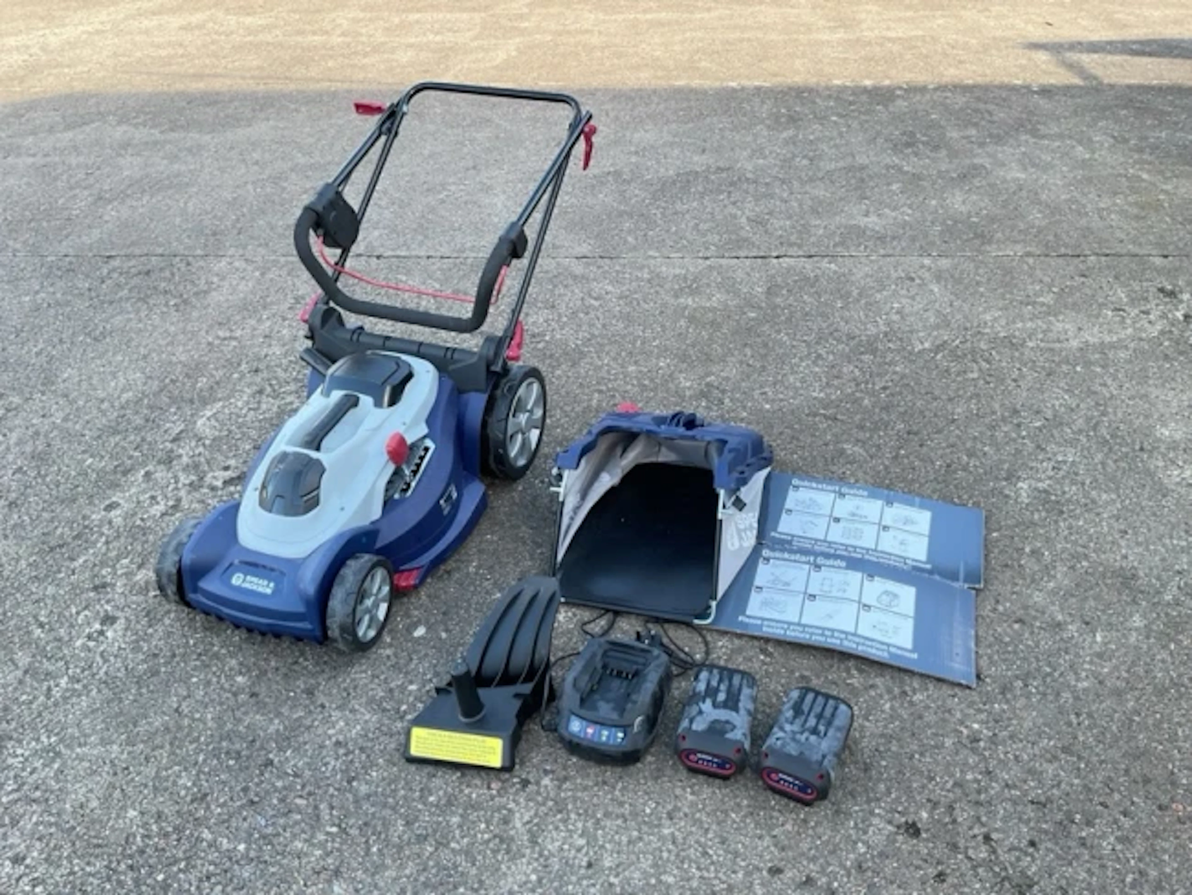 A new & unused Spear & Jackson quickstart electric garden mower, complete
