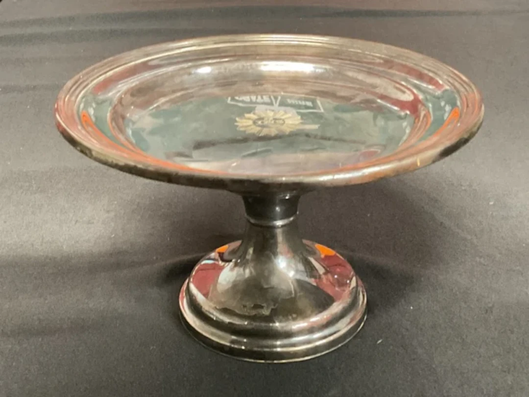 A silver plated ecclesiastical patten by James Dixon & Son of Sheffield