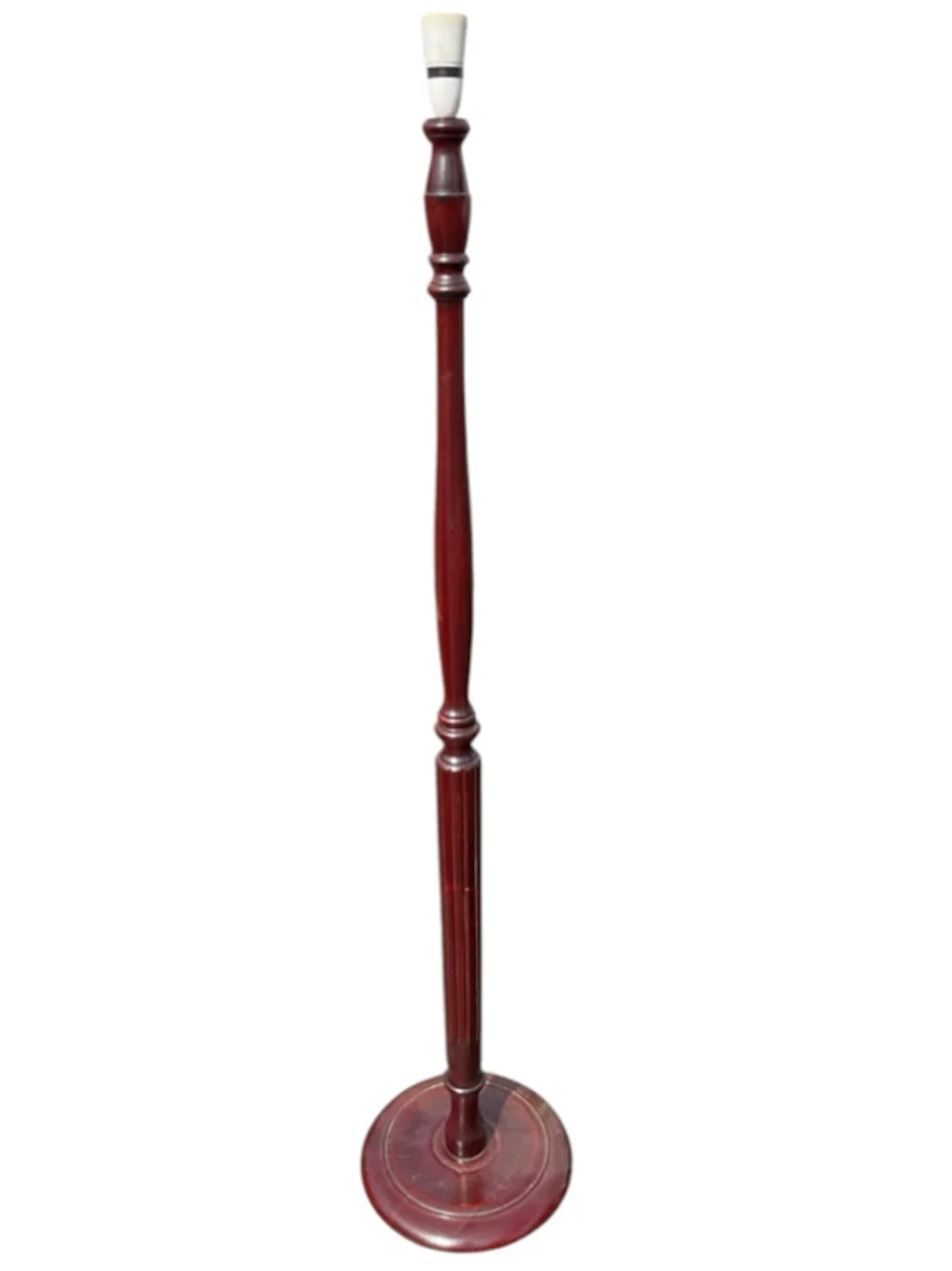 A mahogany standard lamp with turned fluted tapering column on circular