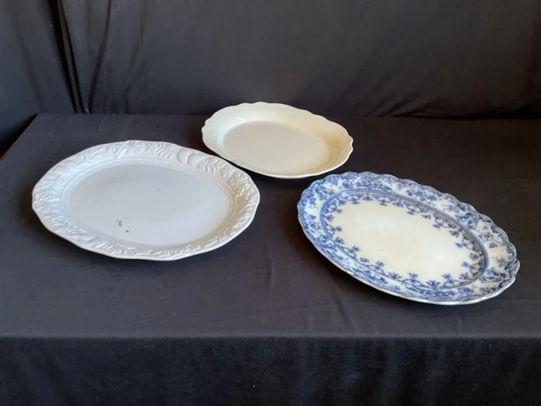 A Victorian ashet with gilt & floral decorated rim by SH of Warwick;