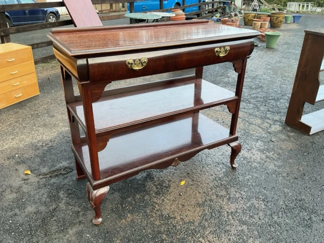 A Victorian mahogany buffet with rectangular moulded top above a cushion